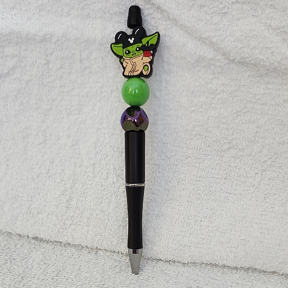 Black Pen with Green and Purple Character Topper